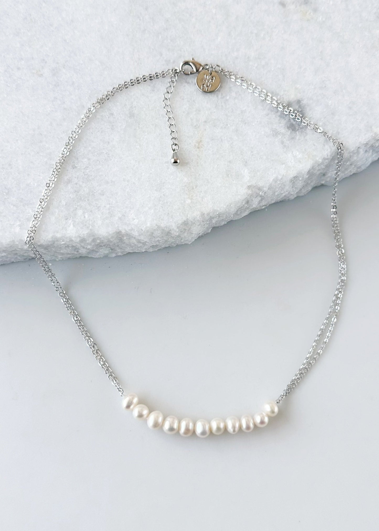 Designed in Canada, the 18” Caroline Necklace (with Extender) features a row (2.5” long) of Pretty Freshwater Pearls on Two Strands on Delicate Gold-Plated Chain.