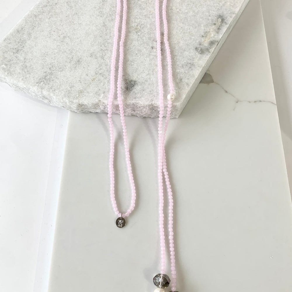 Long, 64-inch Lariat-Style Necklace with Pink Crystals and White Freshwater Pearls.  This Versatile piece allows it to be worn in many ways.