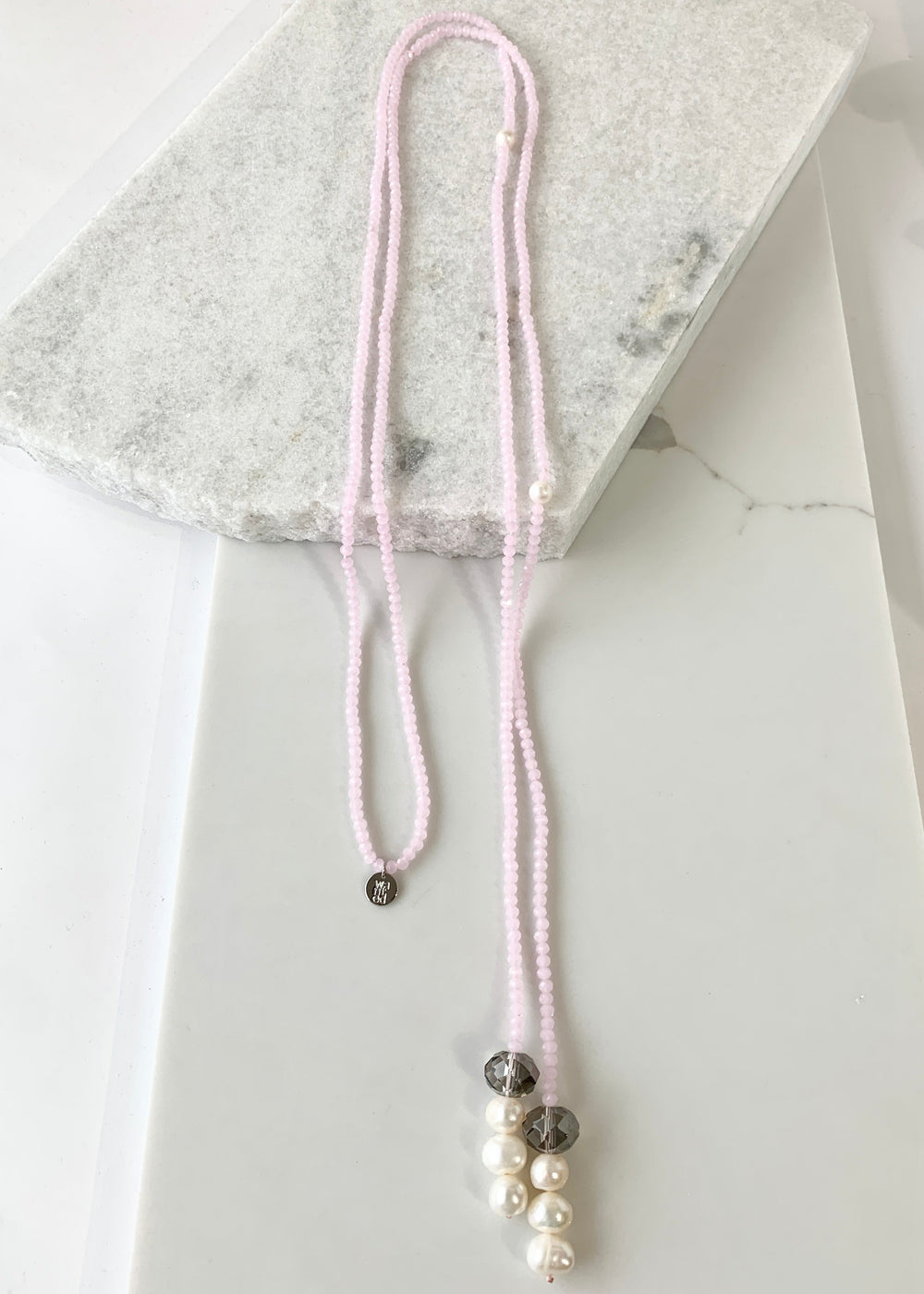 Long, 64-inch Lariat-Style Necklace with Pink Crystals and White Freshwater Pearls.  This Versatile piece allows it to be worn in many ways.