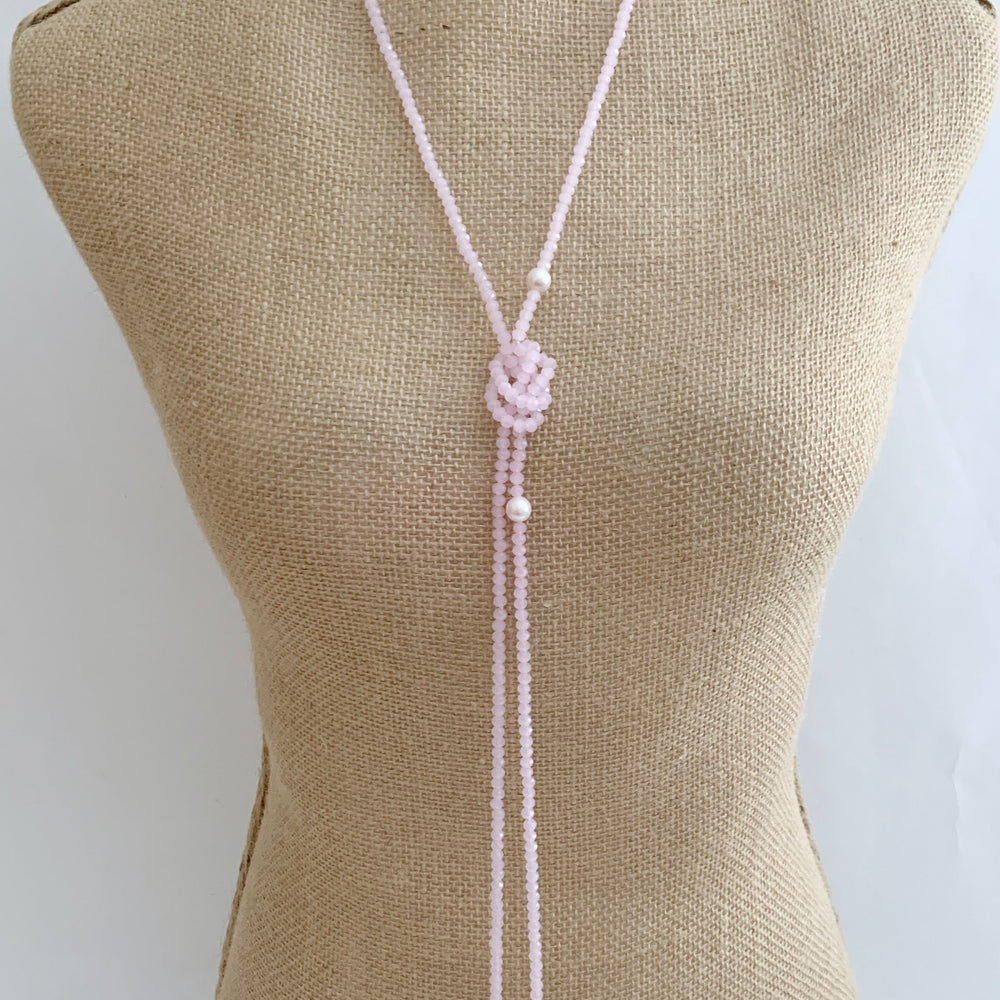 
                      
                        Long, 64-inch Lariat-Style Necklace with Pink Crystals and White Freshwater Pearls.  This Versatile piece allows it to be worn in many ways. Shown on Bust in one Style.
                      
                    