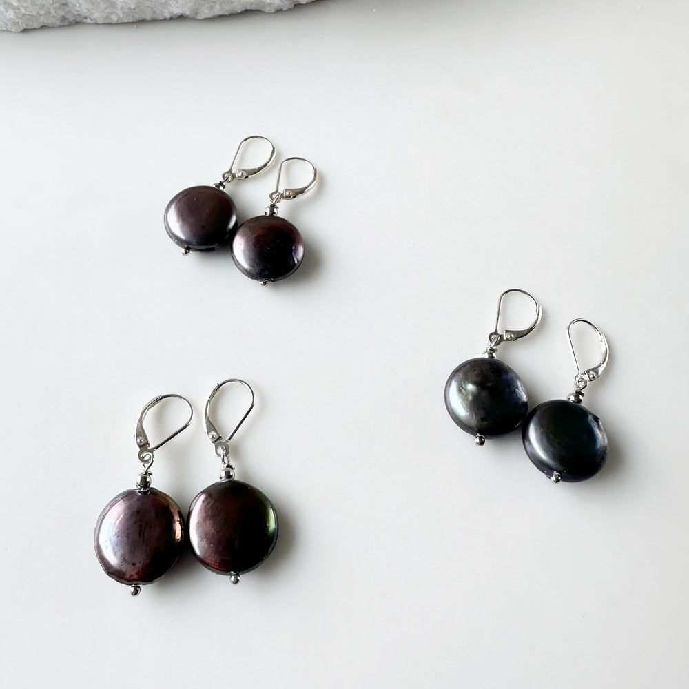 
                      
                        Black/Peacock Freshwater Coin Pearl Earrings with white crystal bead on Sterling Silver Lever backs.
                      
                    