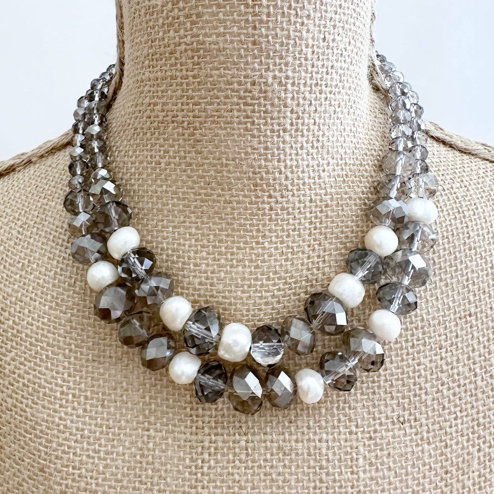 
                      
                        Two Strand White Freshwater Pearl Necklace with Large Faceted Smoke Crystals Joined by a Strong Secure Magnetic Clasp for Easy Wear.  On Bust
                      
                    