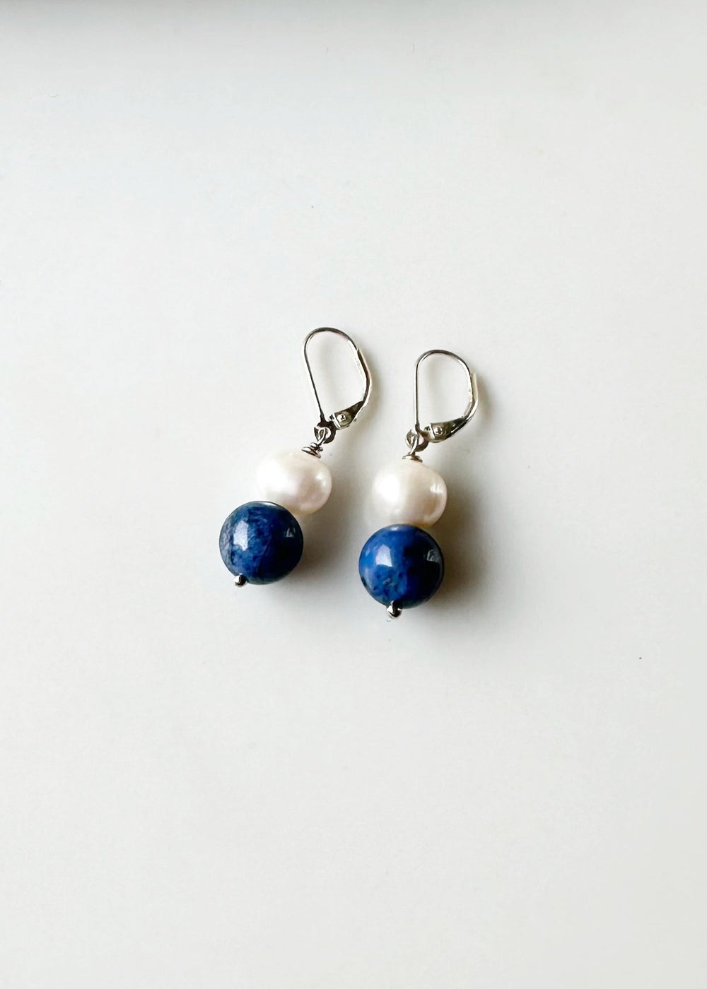 Blue dumortierite and white pearl earrings