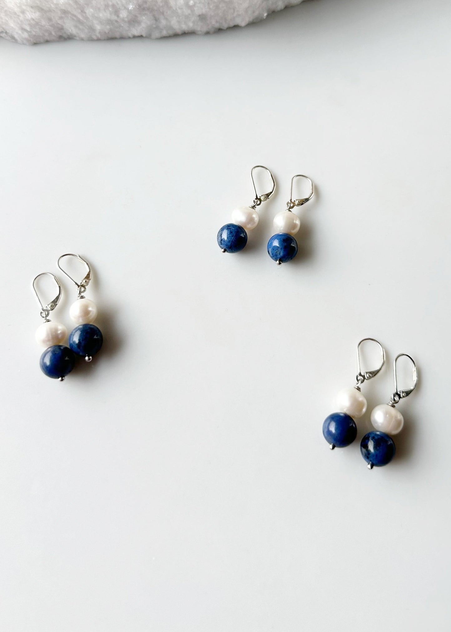 Blue dumortierite and white pearl earrings