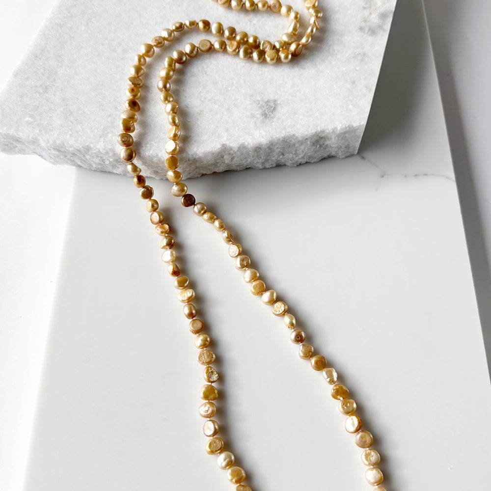 Long Necklace in Gold Baroque Freshwater Pearls. Wear as long Single strand or Doubled.