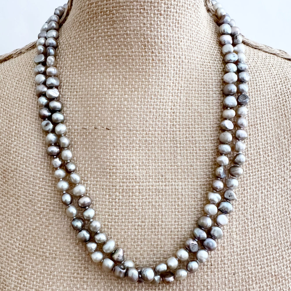 
                      
                        Long Necklace in Silver Baroque Freshwater Pearls. Wear as long Single strand or Doubled. On Bust
                      
                    