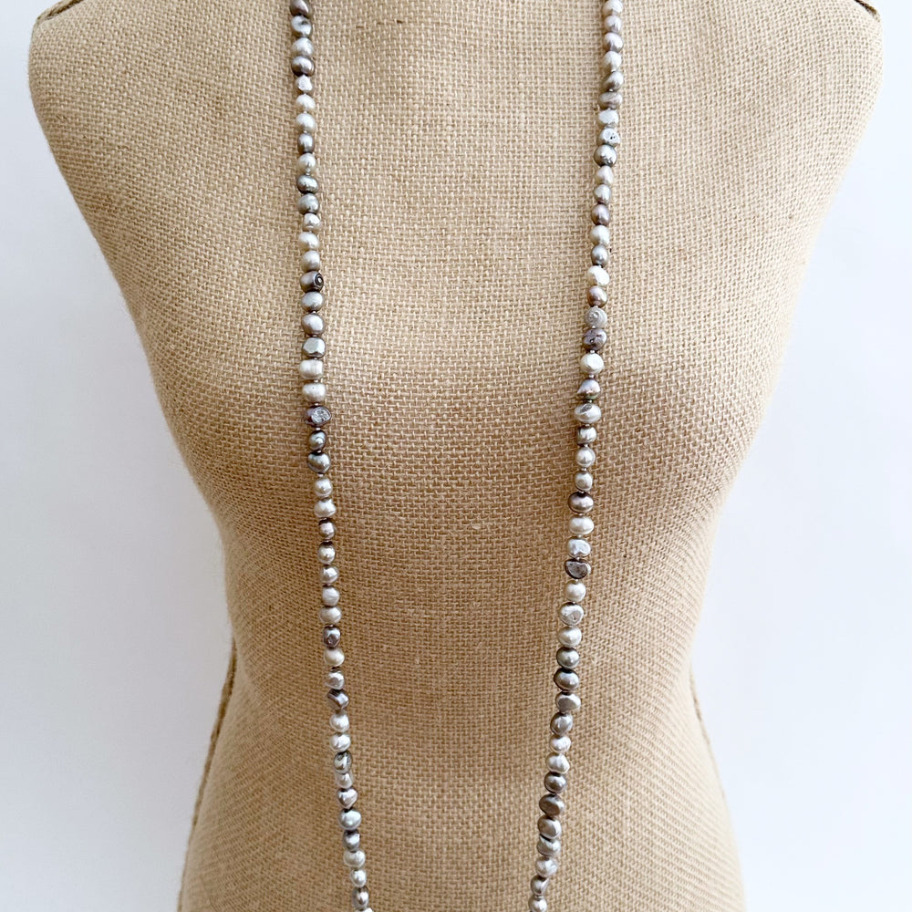
                      
                        Long Necklace in Silver Baroque Freshwater Pearls. Wear as long Single strand or Doubled. On Bust
                      
                    