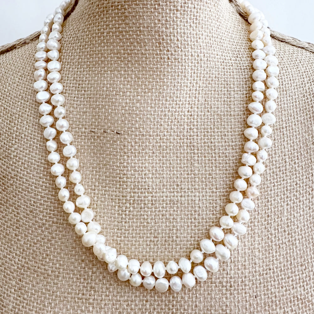 
                      
                        Long Necklace in White Baroque Freshwater Pearls. Wear as long Single strand or Doubled. On Bust
                      
                    