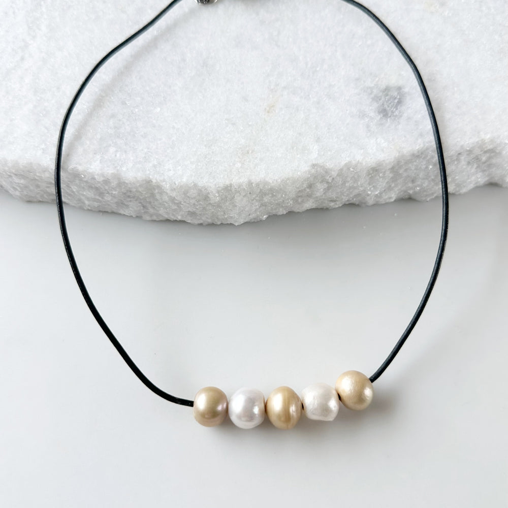 
                      
                        Five Large Gold and White Freshwater Pearls Floating on Black Leather secured by a Strong Magnetic Clasp for Easy wear.
                      
                    