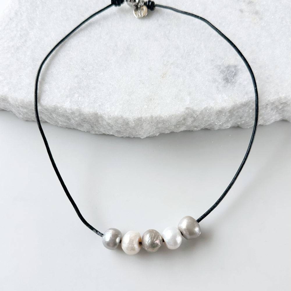 Five Large Silver and White Freshwater Pearls Floating on Black Leather secured by a Strong Magnetic Clasp for Easy wear.