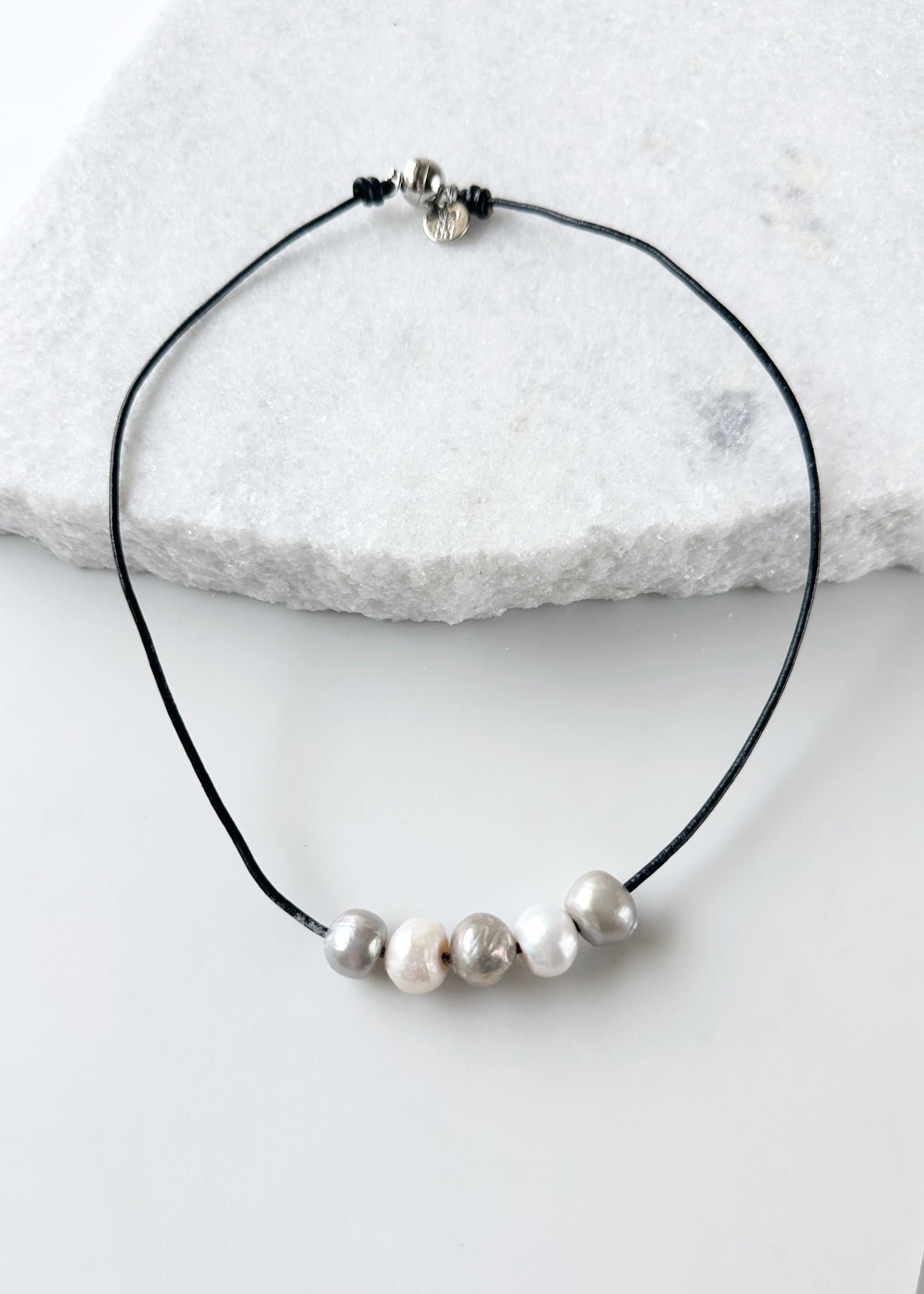 Five Large Silver and White Freshwater Pearls Floating on Black Leather secured by a Strong Magnetic Clasp for Easy wear.