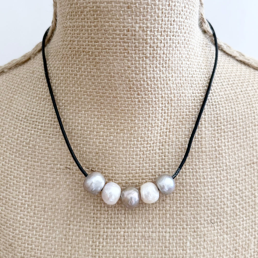 
                      
                        Five Large Silver and White Freshwater Pearls Floating on Black Leather secured by a Strong Magnetic Clasp for Easy wear. On Bust
                      
                    