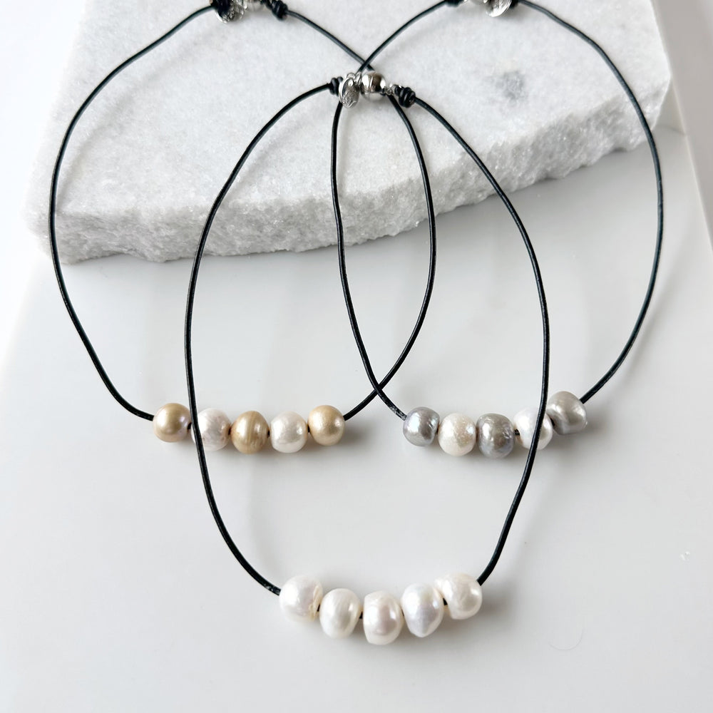 
                      
                        Five Large Freshwater Pearls Floating on Black Leather secured by a Strong Magnetic Clasp for Easy wear. Three Varieties shown
                      
                    