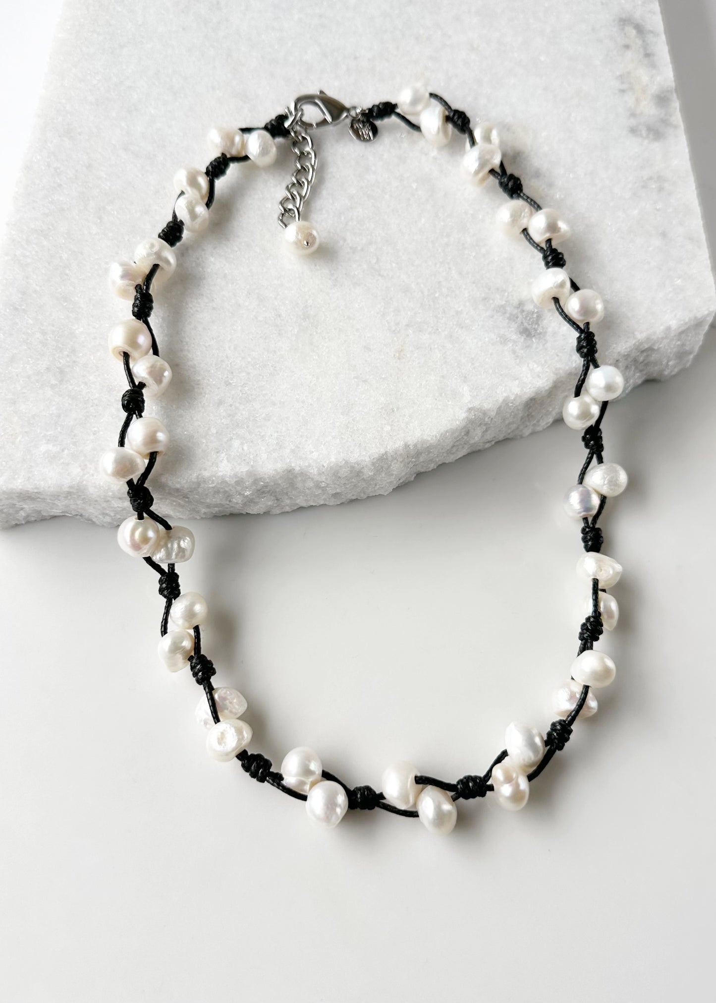This Casually Elegant 23” Necklace has Large Organic Freshwater Pearls Knotted on Cotton Cord with a Large Lobster Claw Clasp and a 2" extender chain. Perfect for everyday! Designed in Canada