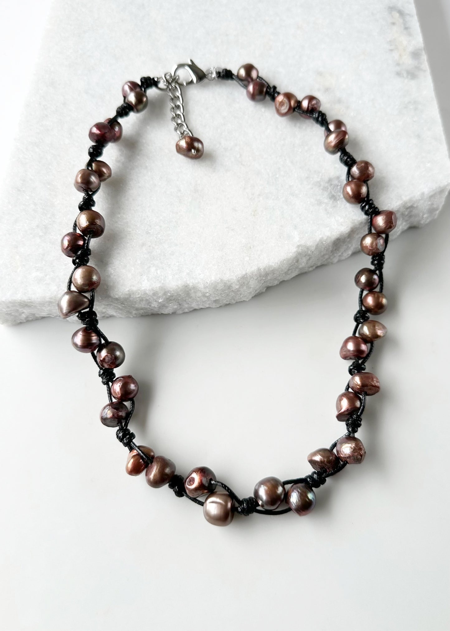 This Casually Elegant 23” Necklace has Large Organic Freshwater Pearls Knotted on Cotton Cord with a Large Lobster Claw Clasp and a 2" extender chain. Perfect for everyday! Designed in Canada