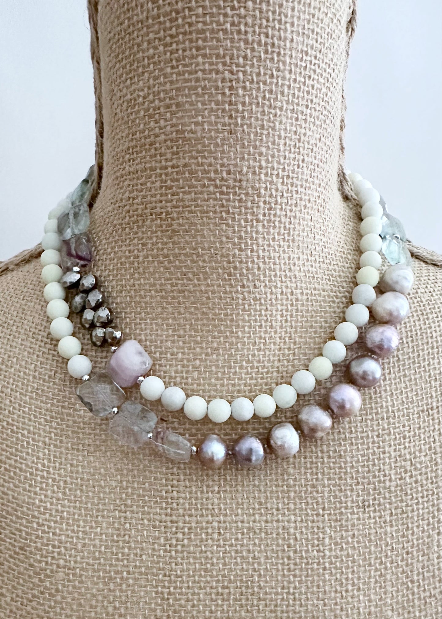 Designed and Made in Canada, this Gorgeous One-Of-A-Kind 36” Necklace features Faceted, Square, Light, Green Fluorite, Pink Kunzite, Jasper, Hematite and Large Pink Pearls finished with a Large lobster Claw Clasp.  Wear it long or doubled.
