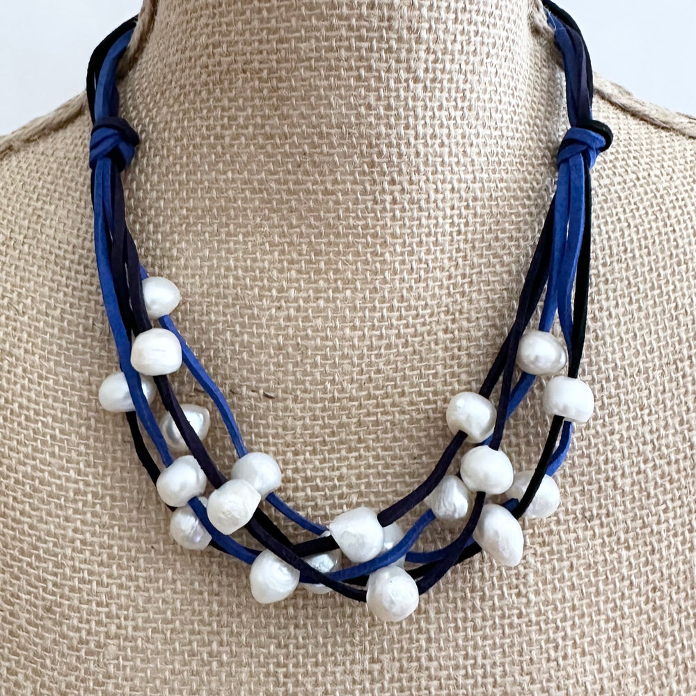 
                      
                        Five Strands of Blue and Black Vegan Suede with Floating White Freshwater Pearls are Offered with a Strong Secure Magnetic Clasp for Easy Wear. On Bust
                      
                    