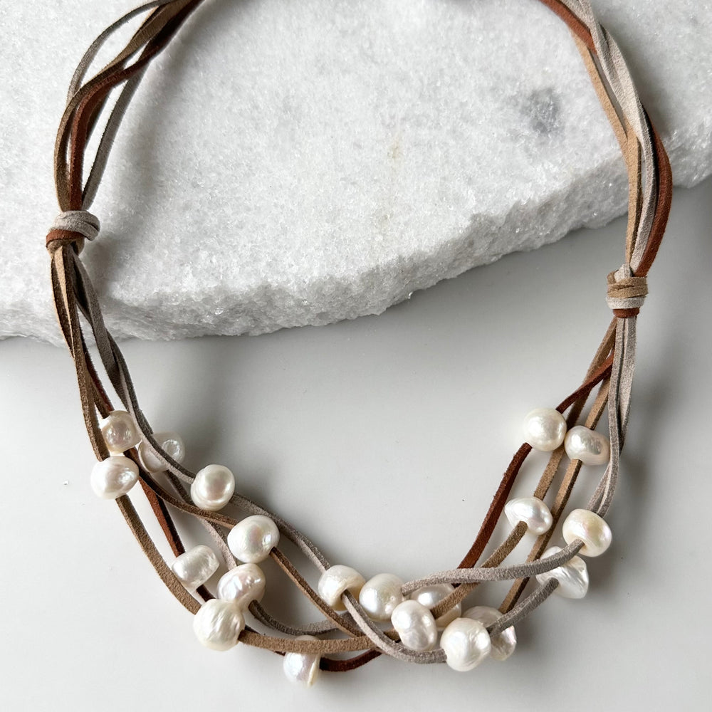 Five Strands of Brown Vegan Suede with Floating White Freshwater Pearls are Offered with a Strong Secure Magnetic Clasp for Easy Wear.