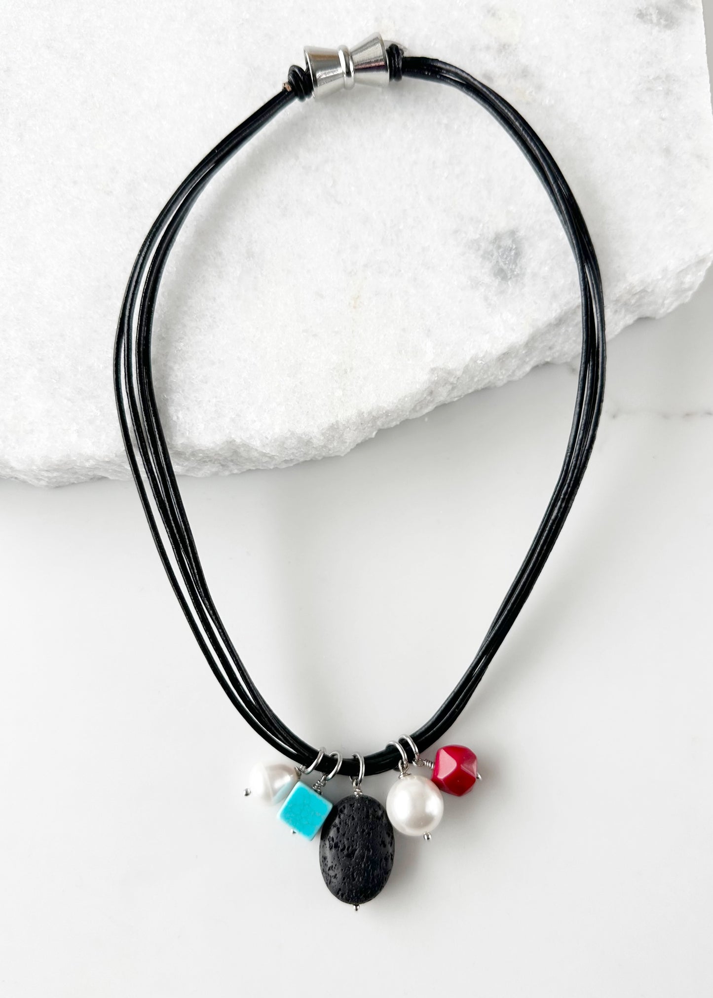 Multi-Strand Black Leather Necklace Featuring Freshwater Pearls, a Mix of Agate and a Shell Pearl Drop all on a Strong Secure Magnetic Clasp for Easy Wear.