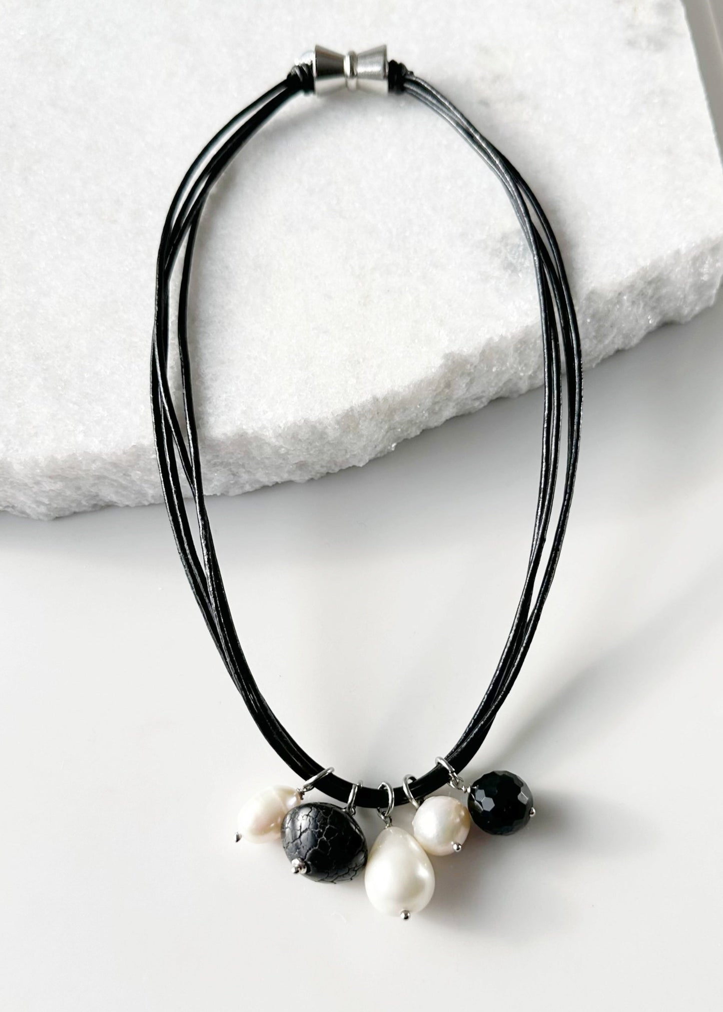 Multi-Strand Black Leather Necklace Featuring Freshwater Pearls, a Mix of Black Agate and a Shell Pearl Drop all on a Strong Secure Magnetic Clasp for Easy Wear.