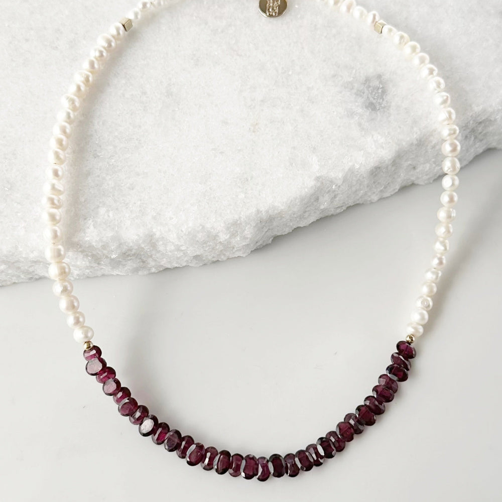Designed and made in Canada, this one-of-a-kind 18” Necklace features Beautiful Oval-Faceted 7mm Garnets and White Freshwater Pearls Accented with Gold and Finished with a Gold-Filled Lobster Claw clasp.
