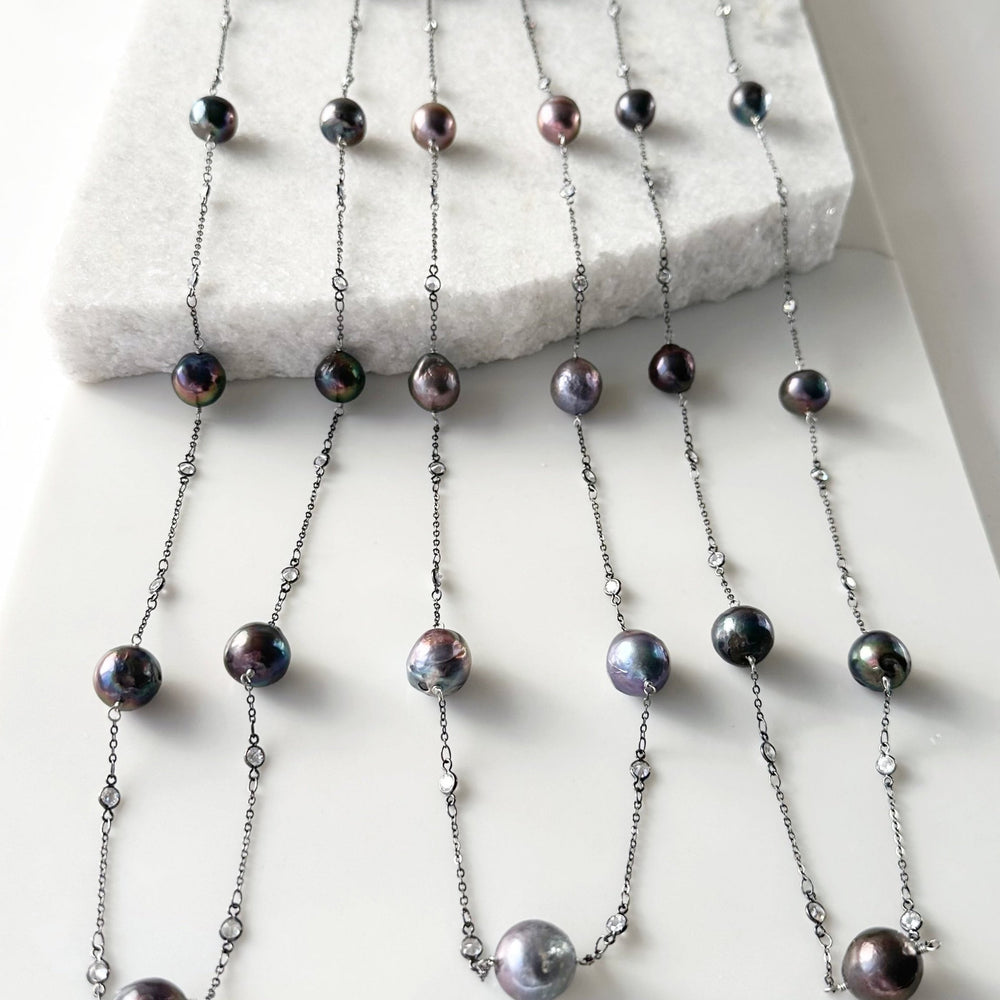Long (36”) Necklace with Large Edison Freshwater Pearls on Gunmetal Chain with Crystal Links.  A Lobster Claw Clasp with a 1.5" extender Aids in Easy Wear.  Three Shown