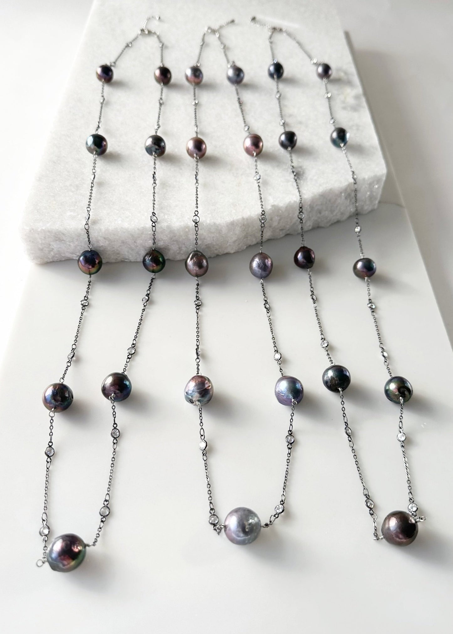 Long (36”) Necklace with Large Edison Freshwater Pearls on Gunmetal Chain with Crystal Links.  A Lobster Claw Clasp with a 1.5" extender Aids in Easy Wear.  Three Shown