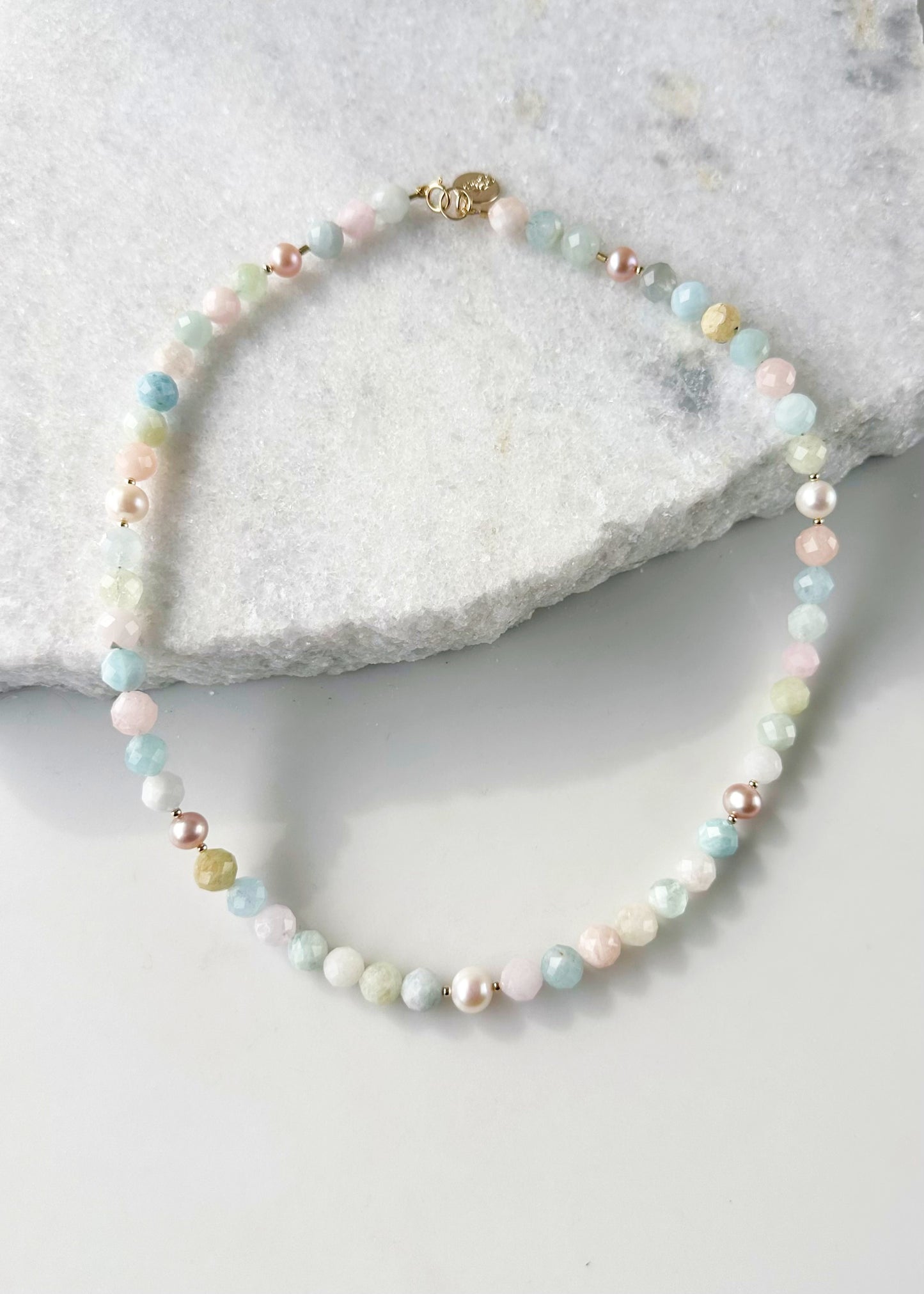 Designed and made in Canada, this Charming Limited-Edition 18.5” Necklace has pretty, Faceted Morganite in Pastel Shades of Pink, Blue, Green, plus Lustrous White and Pink Pearls. The piece is Finished with a Gold-Filled Spring Ring Clasp and Accented with Gold-Filled Beads.
