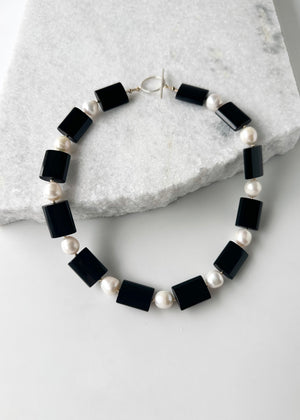 
                  
                    ONYX & PEARL NECKLACE - WANTED ONE OF A KIND
                  
                
