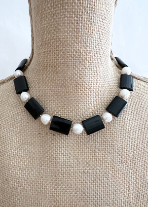 
                  
                    ONYX & PEARL NECKLACE - WANTED ONE OF A KIND
                  
                