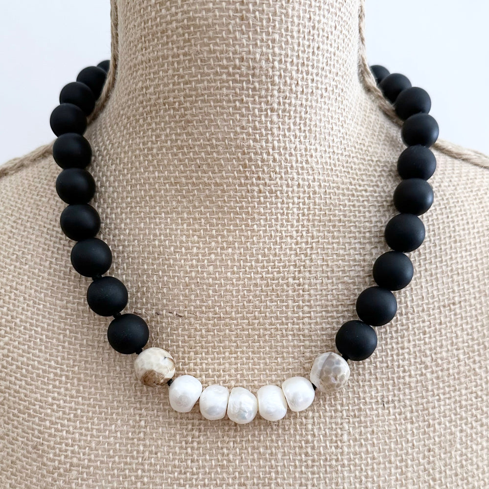 This 21” Necklace Showcases Five Radiant Pearls Accented by Faceted 14mm Beige Agate and Matte Black Agate Stones. It Fastens Effortlessly with a Convenient Magnetic Clasp, Combining Style and Ease. Designed in Canada