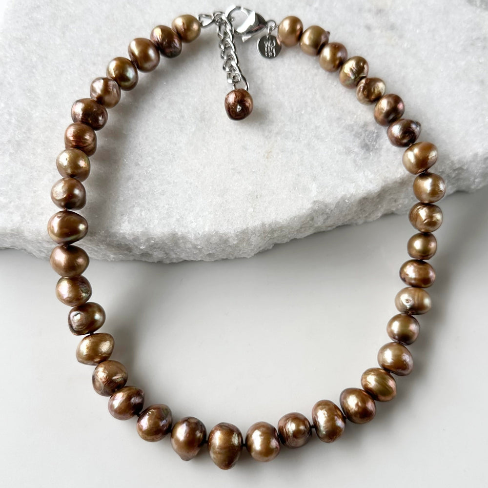 Large Brown Baroque Freshwater Pearls Knotted on 18.5” Necklace with 2” Extender.  A Lobster Claw Clasp Completes this Lustrous Piece.