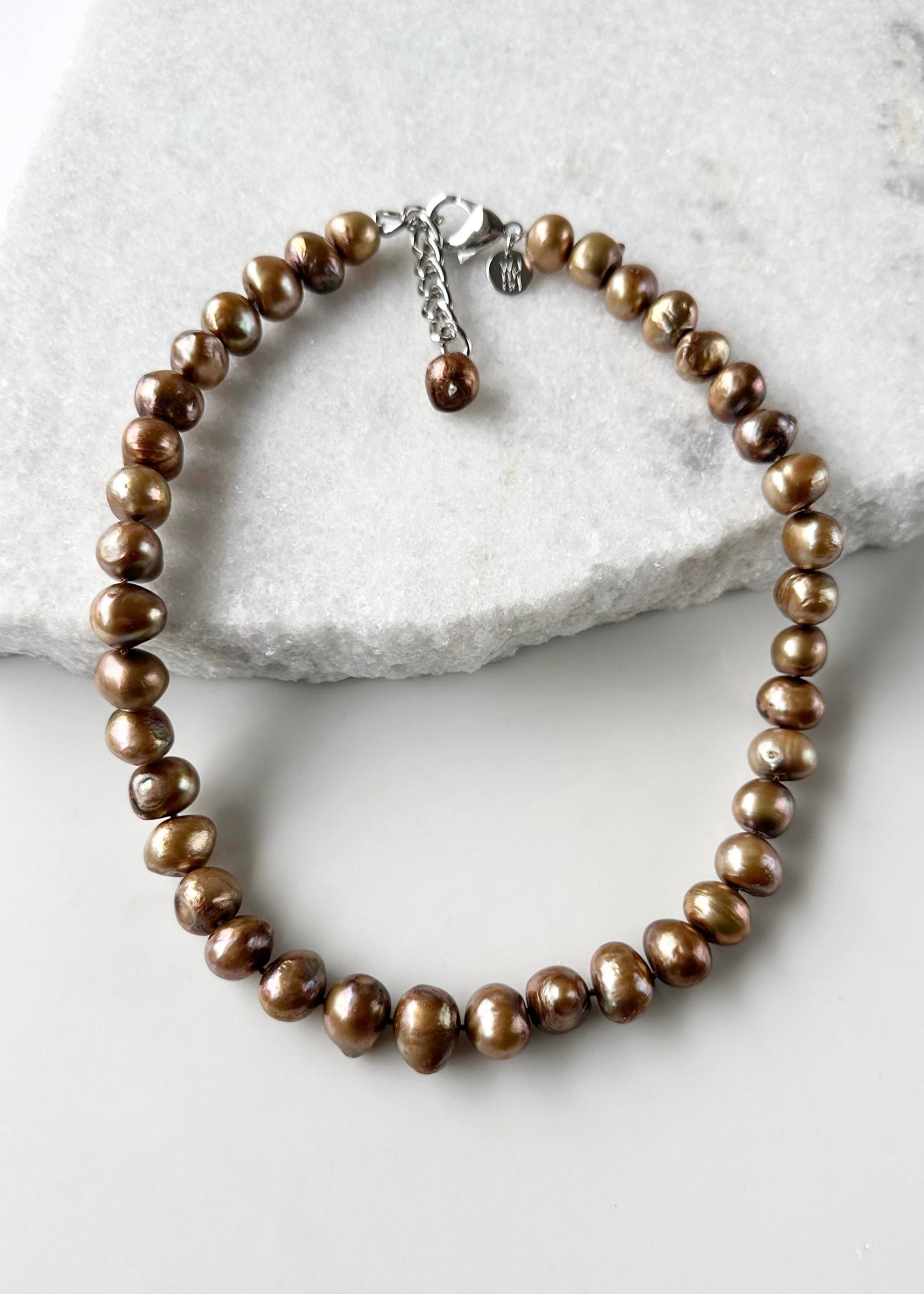 Large Brown Baroque Freshwater Pearls Knotted on 18.5” Necklace with 2” Extender.  A Lobster Claw Clasp Completes this Lustrous Piece.
