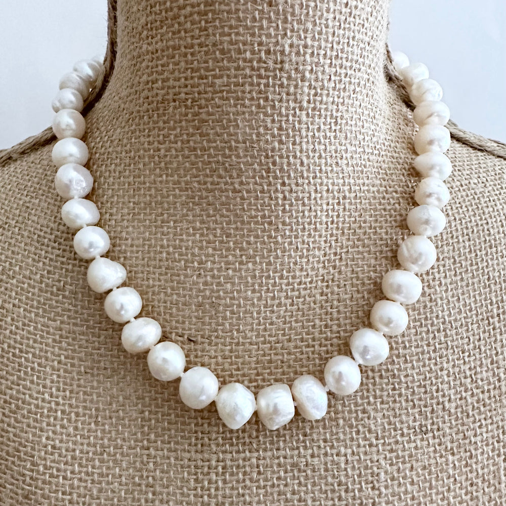 
                      
                        Large White Baroque Freshwater Pearls Knotted on 18.5” Necklace with 2” Extender.  A Lobster Claw Clasp Completes this Lustrous Piece. Shown on Bust
                      
                    