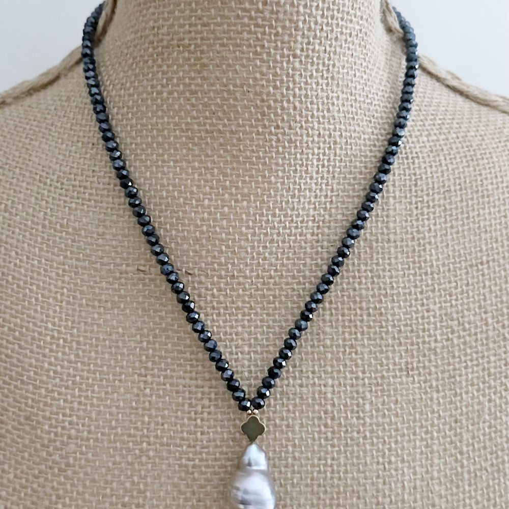 
                      
                        Faceted Navy Crystals form this Necklace with a Large White Baroque Freshwater Pearl Pendant Completed with Gold accents and a Strong Secure Magnetic Clasp for East Wear.
                      
                    