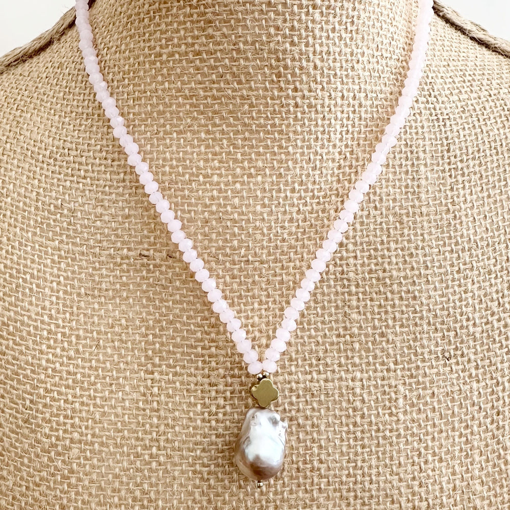 
                      
                        Faceted Pink Crystals form this Necklace with a Large Baroque Freshwater Pearl Pendant Completed with Gold accents and a Strong Secure Magnetic Clasp for East Wear. On Bust
                      
                    