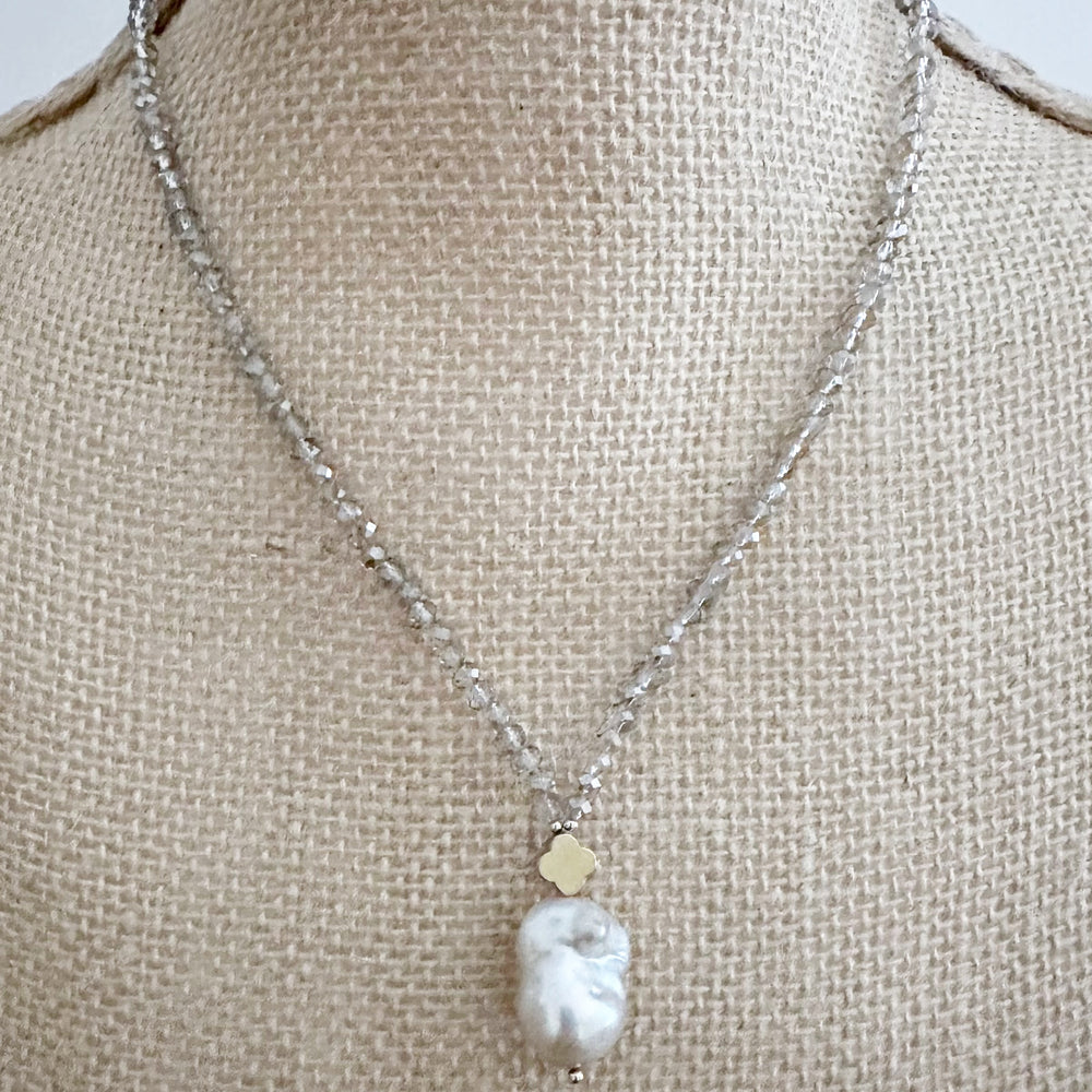 
                      
                        Faceted Smoke Crystals form this Necklace with a Large White Baroque Freshwater Pearl Pendant Completed with Gold accents and a Strong Secure Magnetic Clasp for East Wear.
                      
                    