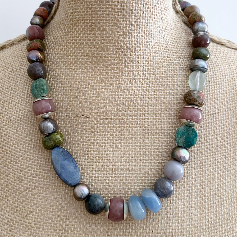 This Exceptional 22.5" Necklace Features a Blend of Jasper, Morango Quartz, Unakite, Fluorite, Dumortierite, Chrysocolla, Pearls, and Silver, with a Sterling silver hook clasp creating a truly one-of-a-kind statement piece. Designed and made in Canada