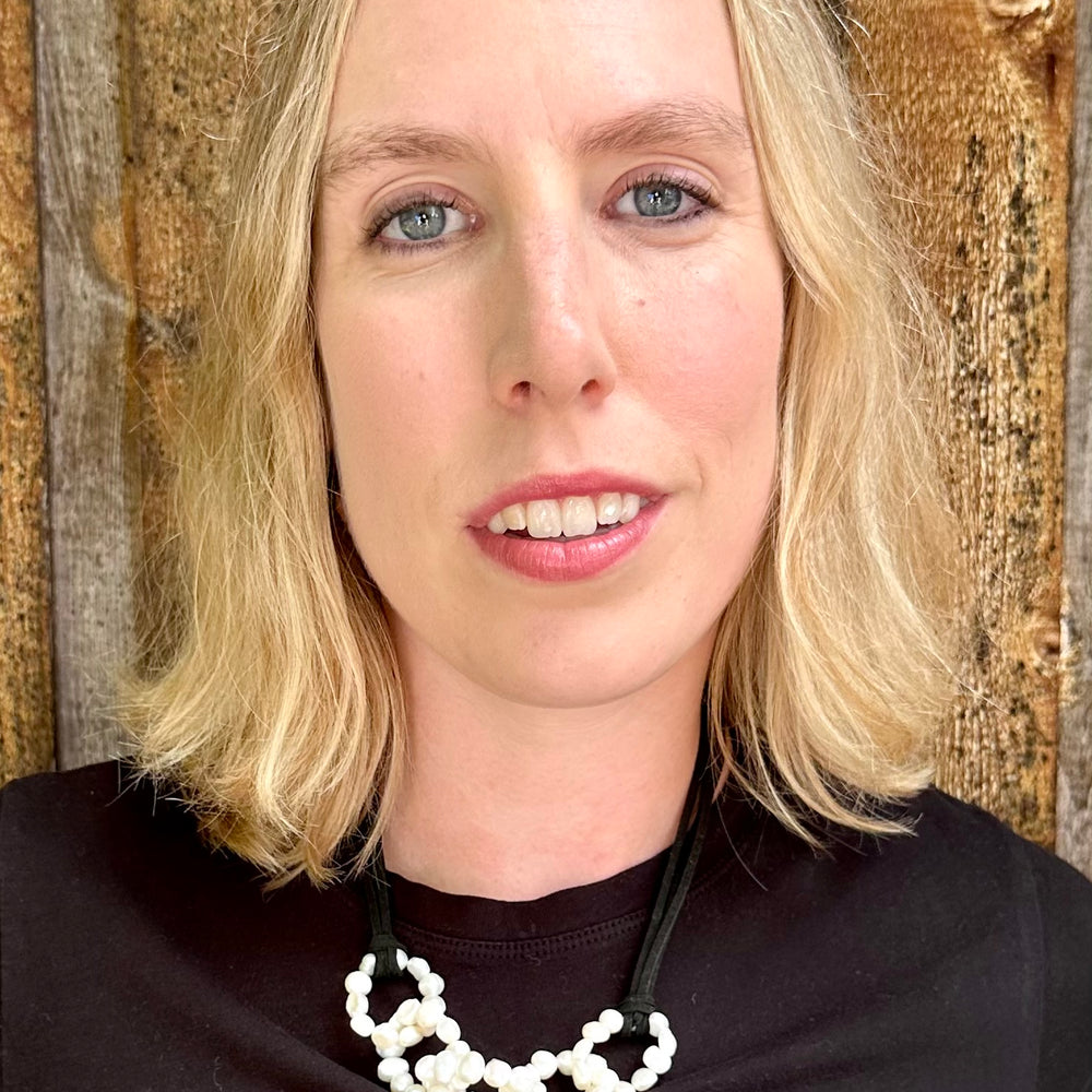 
                      
                        Chain Link of White Baroque Freshwater 8-9mm Pearls Designed with Black Vegan Suede and a Strong Secure Magnetic Clasp for Easy Wear. On Model
                      
                    