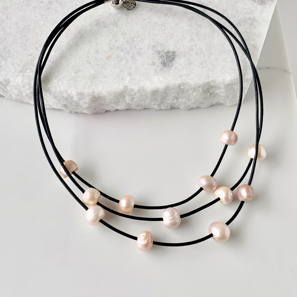 Pink Baroque Freshwater Pearls on Three Graduated Strands of Black Leather Necklace with Strong Secure Magnetic Clasp for Easy Wear.
