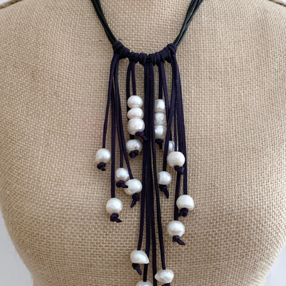 
                      
                        Large Baroque White Freshwater Pearls on Various-Length Strands with Black Vegan Suede and Leather Necklace Completed with a Strong Secure Magnetic Clasp for Easy Wear. On Bust
                      
                    