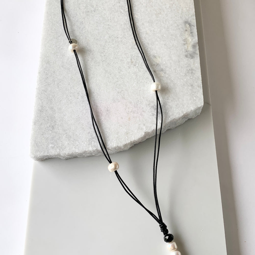 White Freshwater Pearls placed Asymmetrically on Black Leather Necklace with Pearl and Crystal Drop(20.5”).