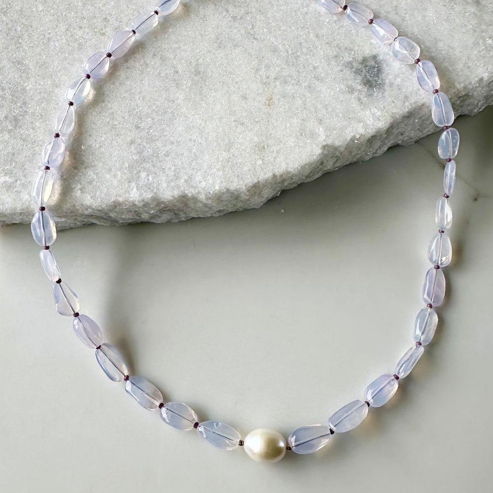 Pretty Limited Edition 20.5" Necklace with Beautiful Lavender Amethyst (Soft Milky Finish) and a Large White Freshwater Pearl with Gold Accents.  Designed and Made in Canada, this piece is Finished with a Gold-Filled Lobster Claw Clasp.