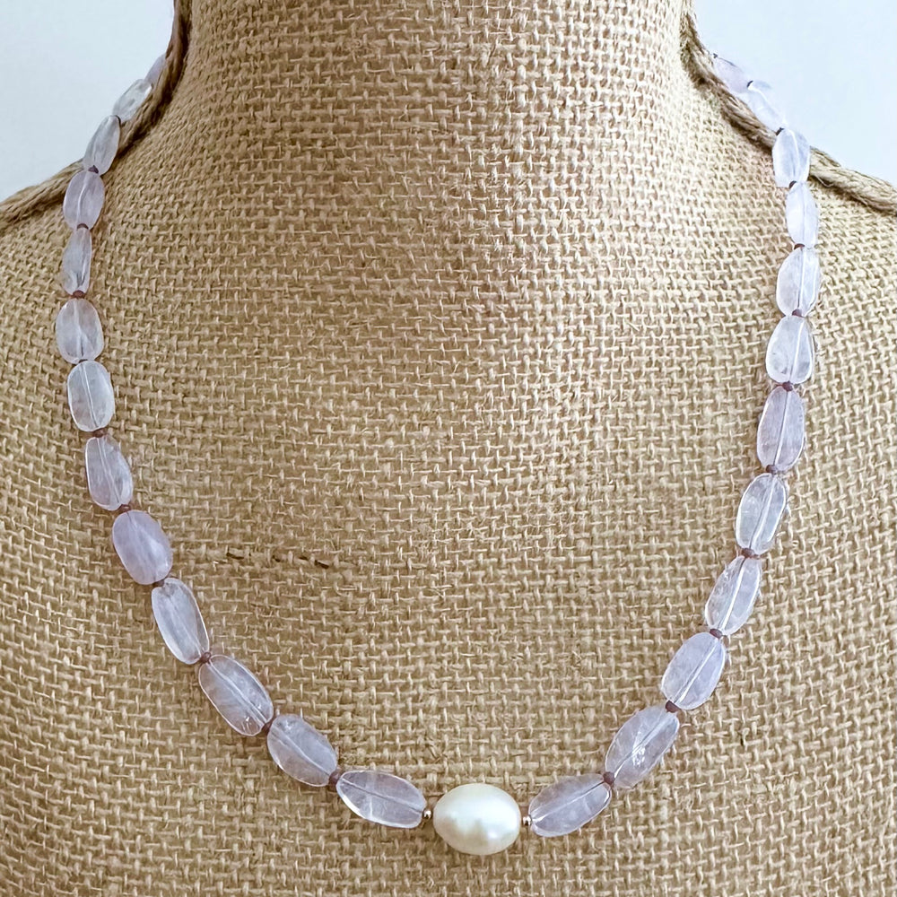 
                      
                        Pretty Limited Edition 20.5" Necklace with Beautiful Lavender Amethyst (Soft Milky Finish) and a Large White Freshwater Pearl with Gold Accents.  Designed and Made in Canada, this piece is Finished with a Gold-Filled Lobster Claw Clasp.
                      
                    