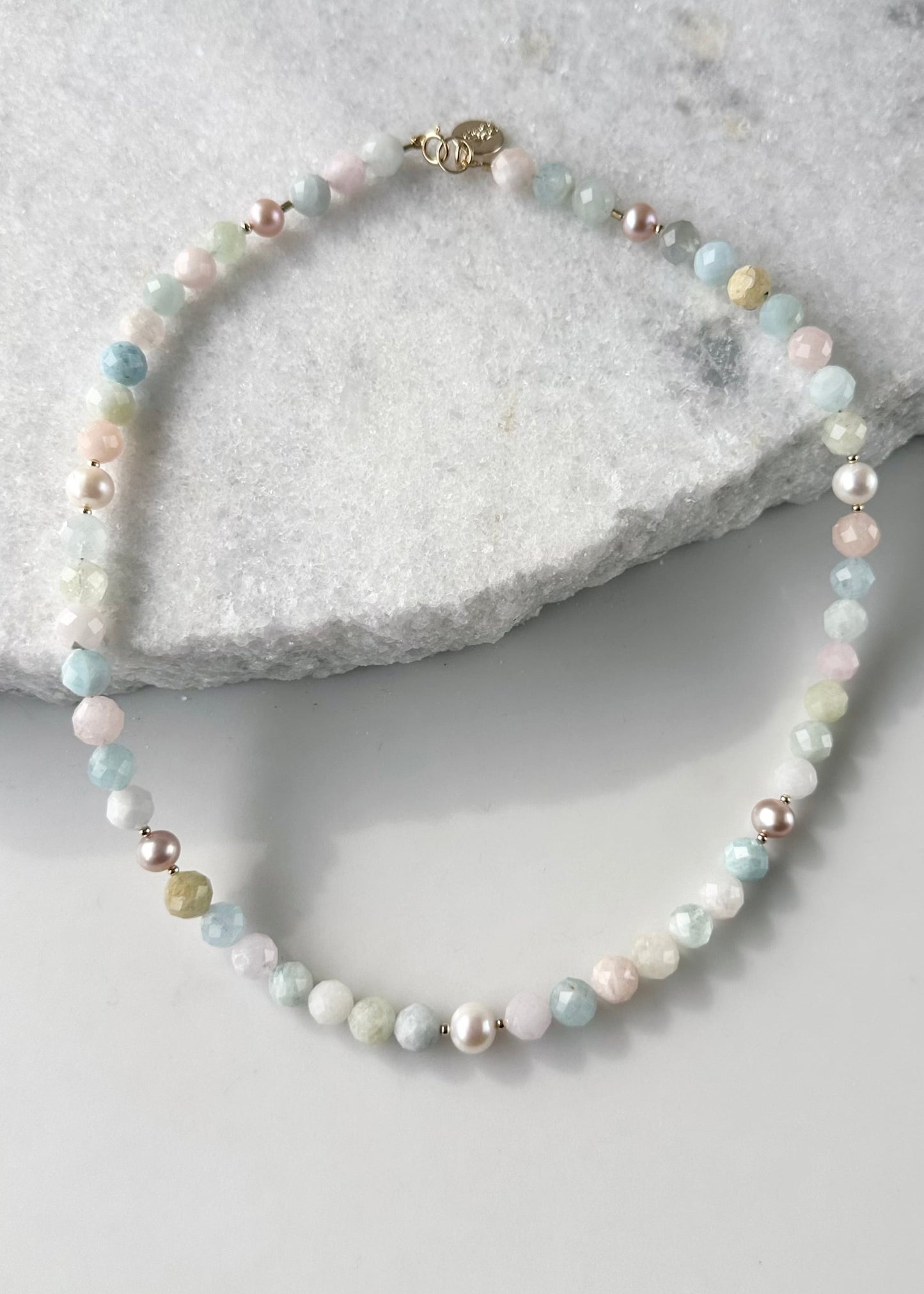Designed and made in Canada, this Charming Limited-Edition 18.5” Necklace has pretty, Faceted Morganite in Pastel Shades of Pink, Blue, Green, plus Lustrous White and Pink Pearls. The piece is Finished with a Gold-Filled Spring Ring Clasp and Accented with Gold-Filled Beads.