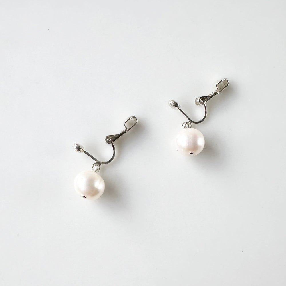 This Elegant Clip-On Earring Features a Beautiful Freshwater White 10mm Pearl Drop on Sterling Silver. Designed and made in Canada