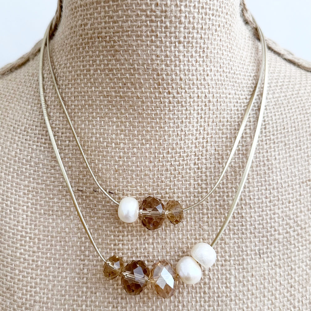 
                      
                        Large Baroque Freshwater White Pearls and Large Gold Crystals on Two Strands of Gold Metallic Cord, Finished by a Strong Secure Magnetic Clasp for Easy Wear.
                      
                    