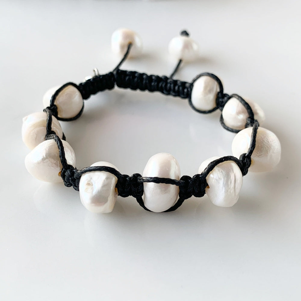 Nine Large White Baroque Freshwater Pearls on Black Knotted Cord Plus Sliding Knot Closure with Two Smaller Pearls to Offer Adjustable Length.