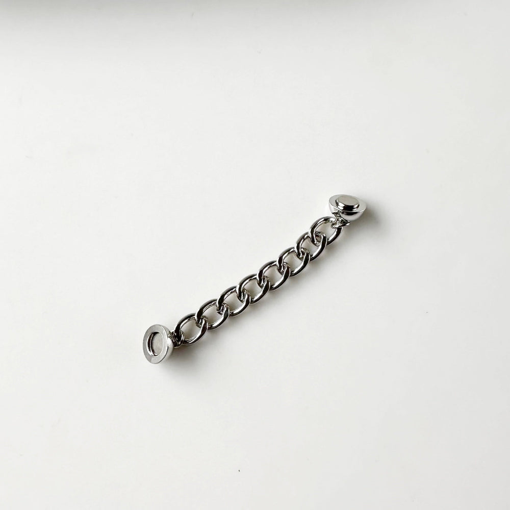 This 2” Extender Chain is Silver-toned and fits with round magnetic clasps on various Wanted Jewelry Necklaces.