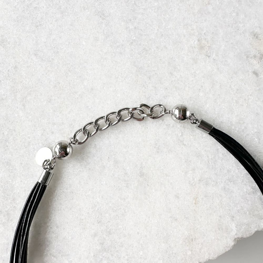 This 2” Extender Chain is Silver-toned and fits with round magnetic clasps on various Wanted Jewelry Necklaces.